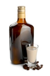 Photo of Coffee cream liqueur in bottle, glass and beans isolated on white