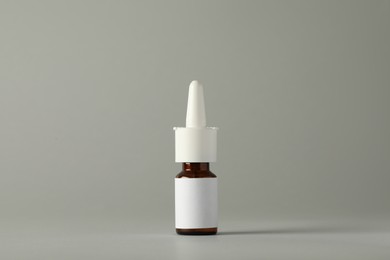 Bottle of nasal spray on light grey background