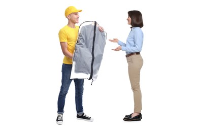 Dry-cleaning delivery. Courier giving garment cover with clothes to woman on white background