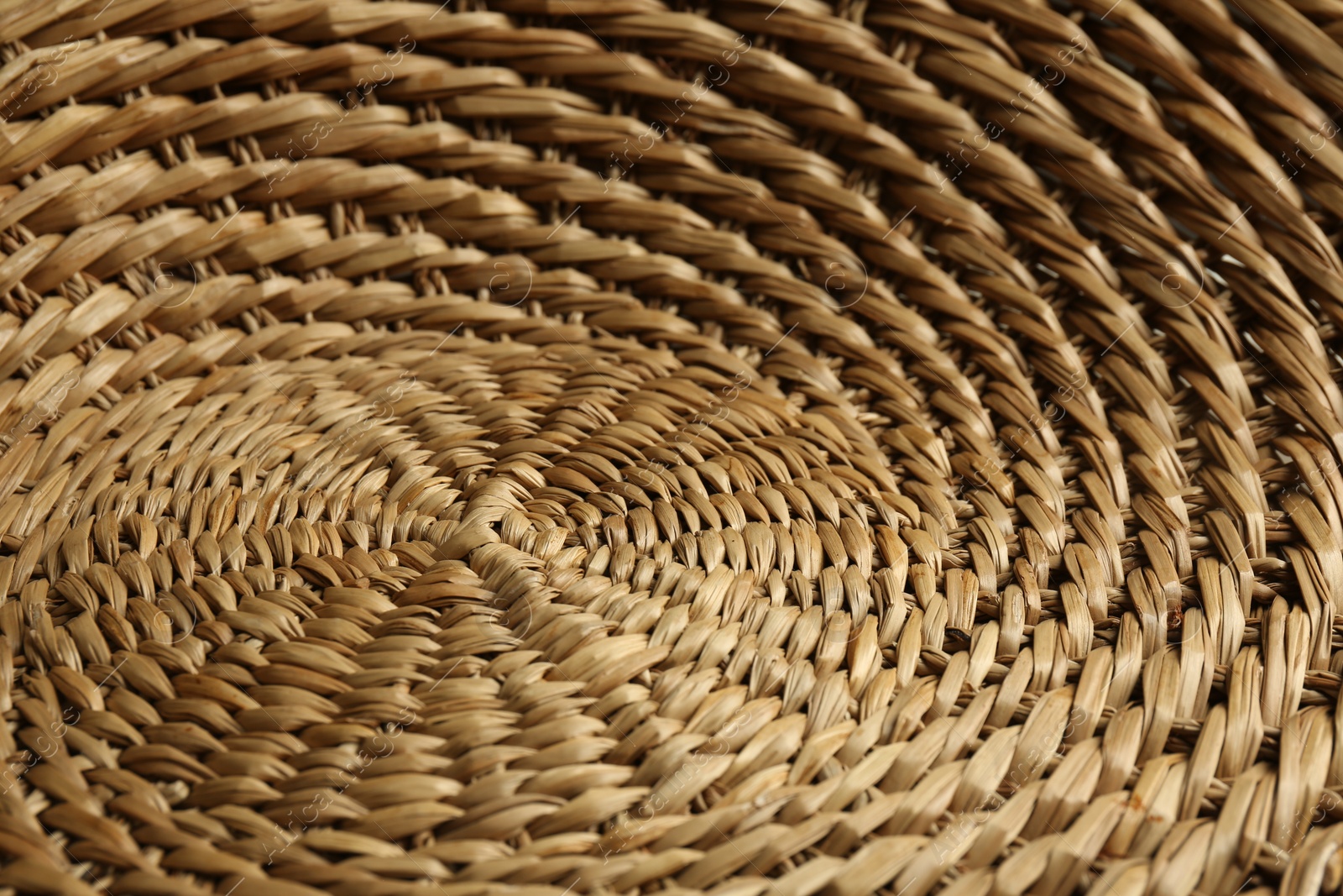 Photo of Empty wicker basket as background, closeup view