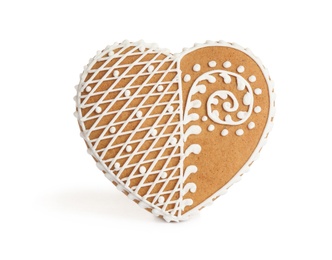 Photo of Gingerbread heart decorated with icing isolated on white