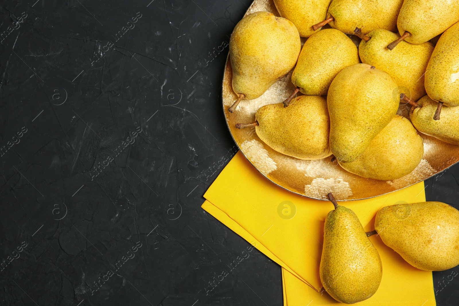 Photo of Flat lay composition with fresh ripe pears and space for text on dark background