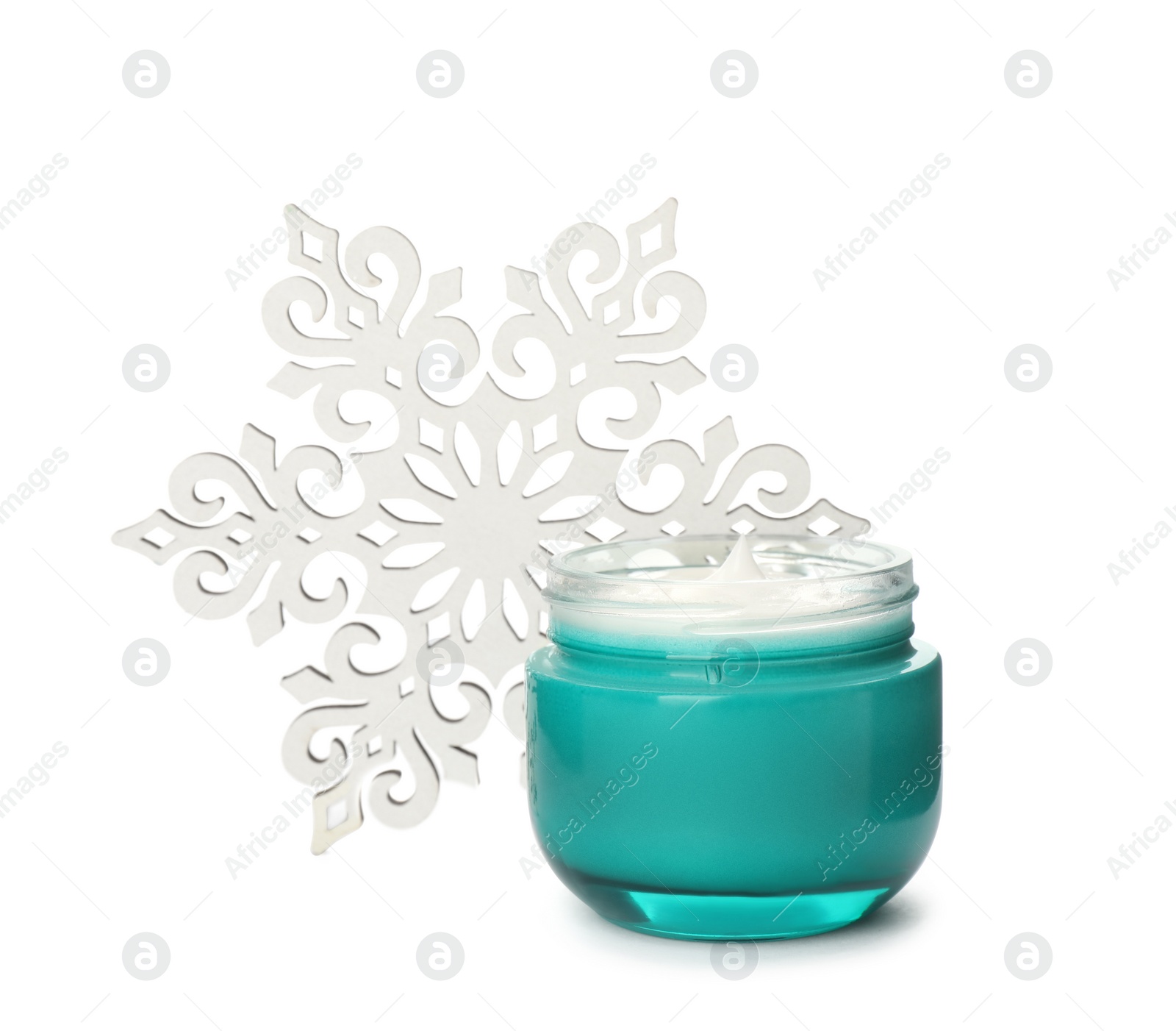 Photo of Jar of cream and snowflake on white background. Winter skin care