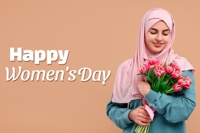 Happy Women's Day - March 8. Attractive lady in hijab with bouquet of tulips on dark beige background