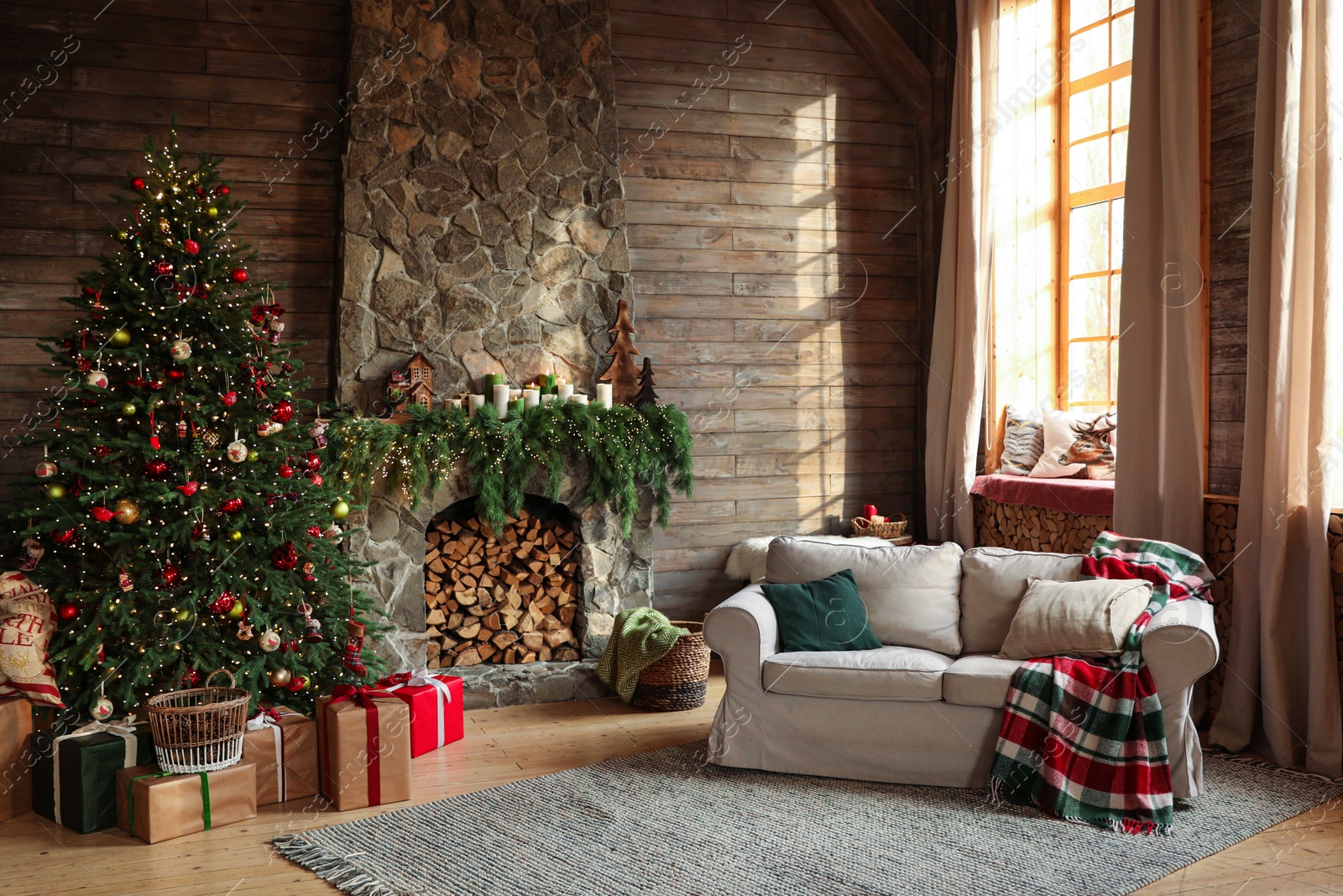 Photo of Festive interior with decorated Christmas tree and fireplace