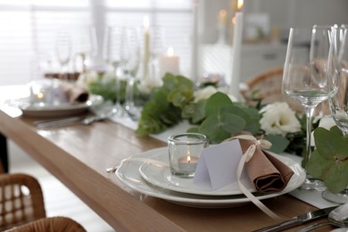 Festive table setting with beautiful tableware and decor indoors