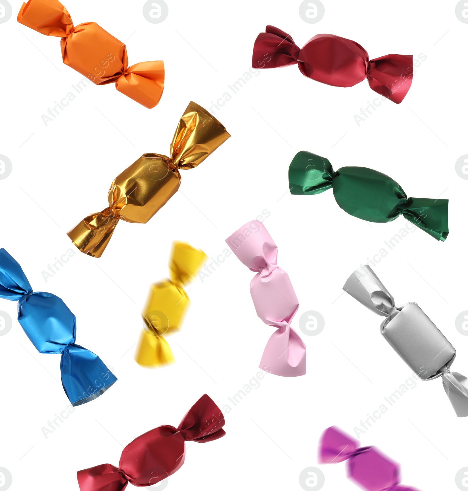 Image of Tasty candies in colorful wrappers falling on white background