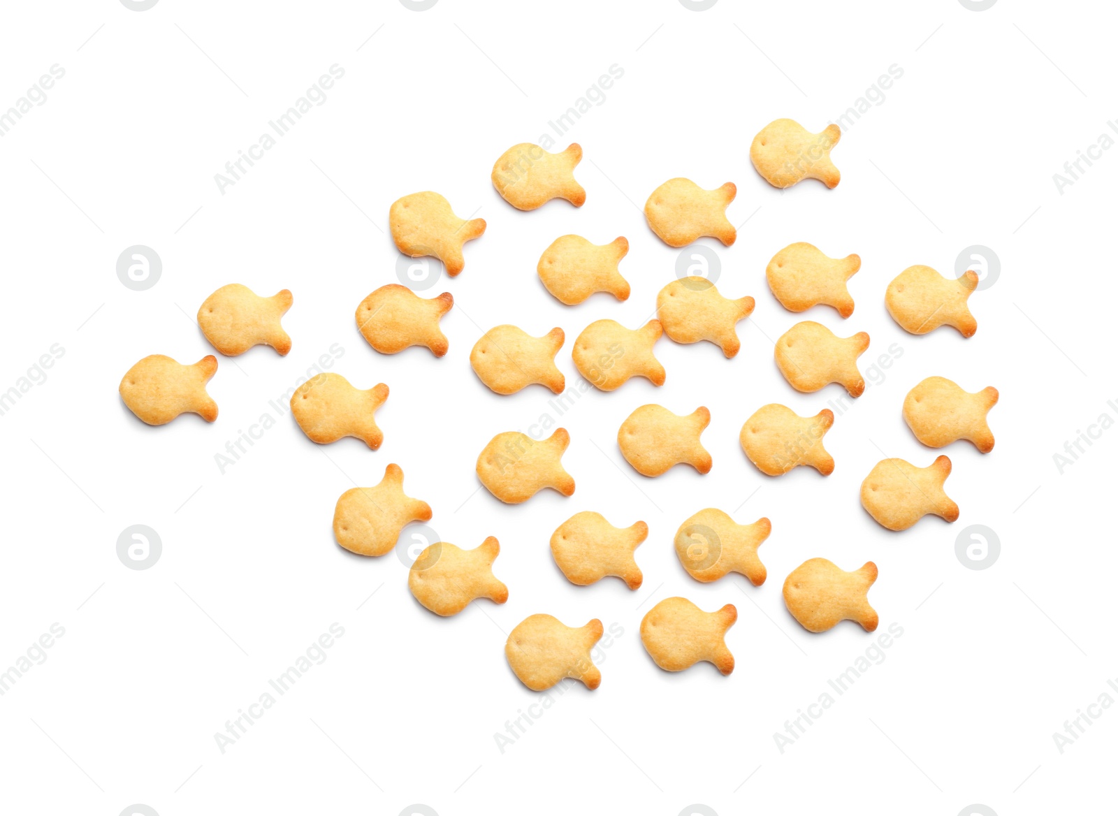 Photo of Delicious crispy goldfish crackers on white background, top view