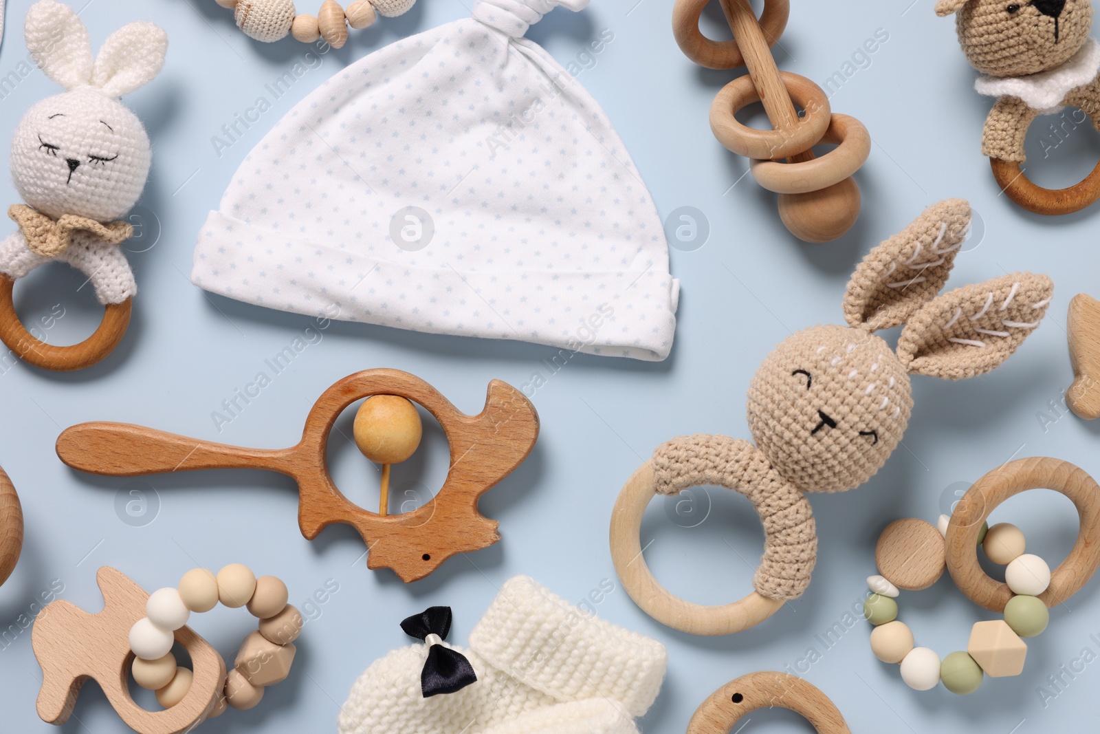 Photo of Different baby accessories on light blue background, flat lay