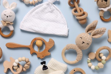 Photo of Different baby accessories on light blue background, flat lay