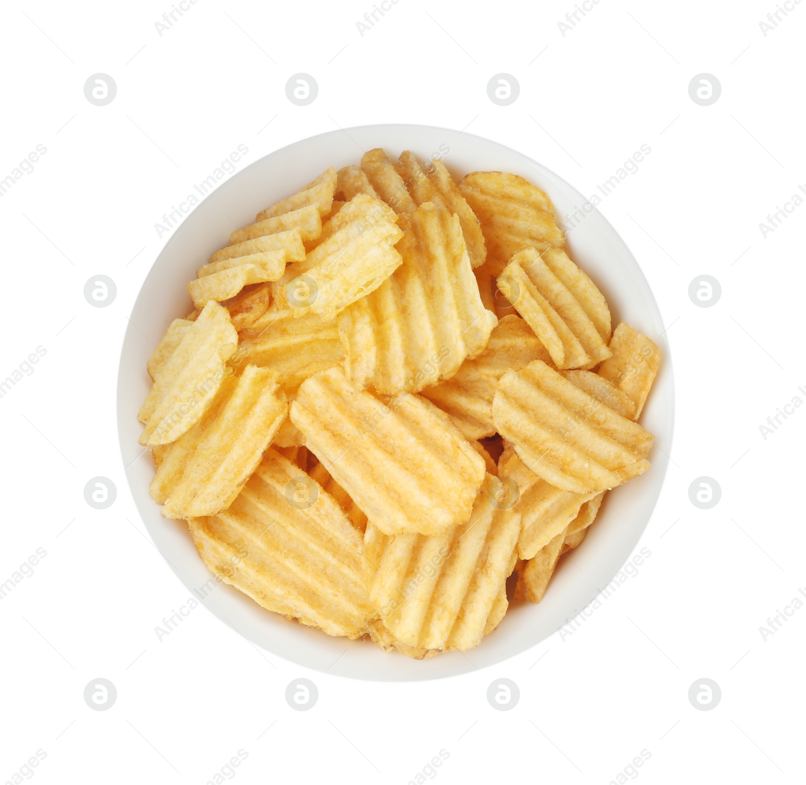 Photo of Bowl of tasty ridged potato chips on white background, top view