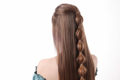 Woman with braided hair on white background, back view