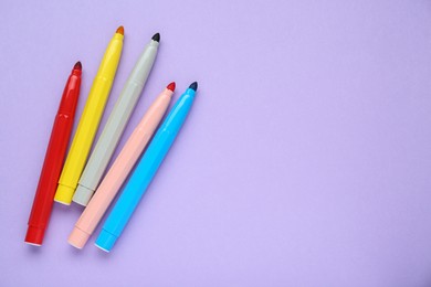Photo of Different colorful markers on light background, flat lay. Space for text