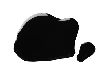 Photo of Blobs of black oil isolated on white, top view