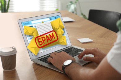 Spam warning message, envelope illustrations popping out of device display. Man using email software on laptop at table, closeup