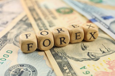 Word Forex made of wooden cubes with letters on banknotes, closeup