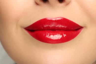 Photo of Closeup view of woman with red lipstick