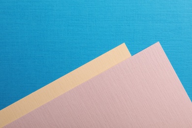 Photo of Colorful paper sheets as background, top view