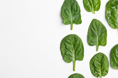 Fresh leaves of spinach isolated on white, top view