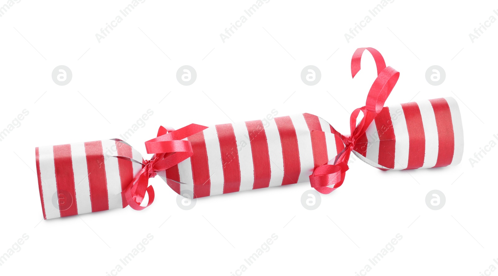 Photo of Bright striped Christmas cracker isolated on white