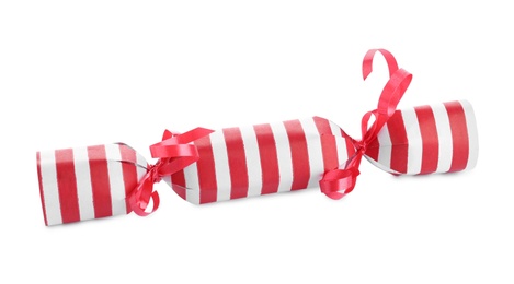 Photo of Bright striped Christmas cracker isolated on white