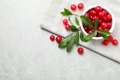 Photo of Flat lay composition with cranberry on light table, space for text