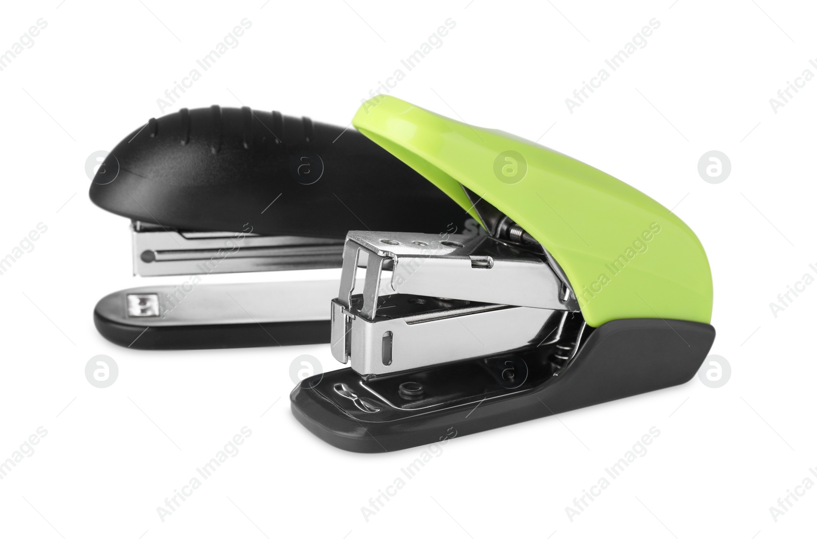 Photo of New bright color staplers isolated on white