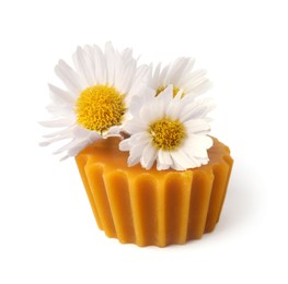 Photo of Natural beeswax cake block and flower isolated on white
