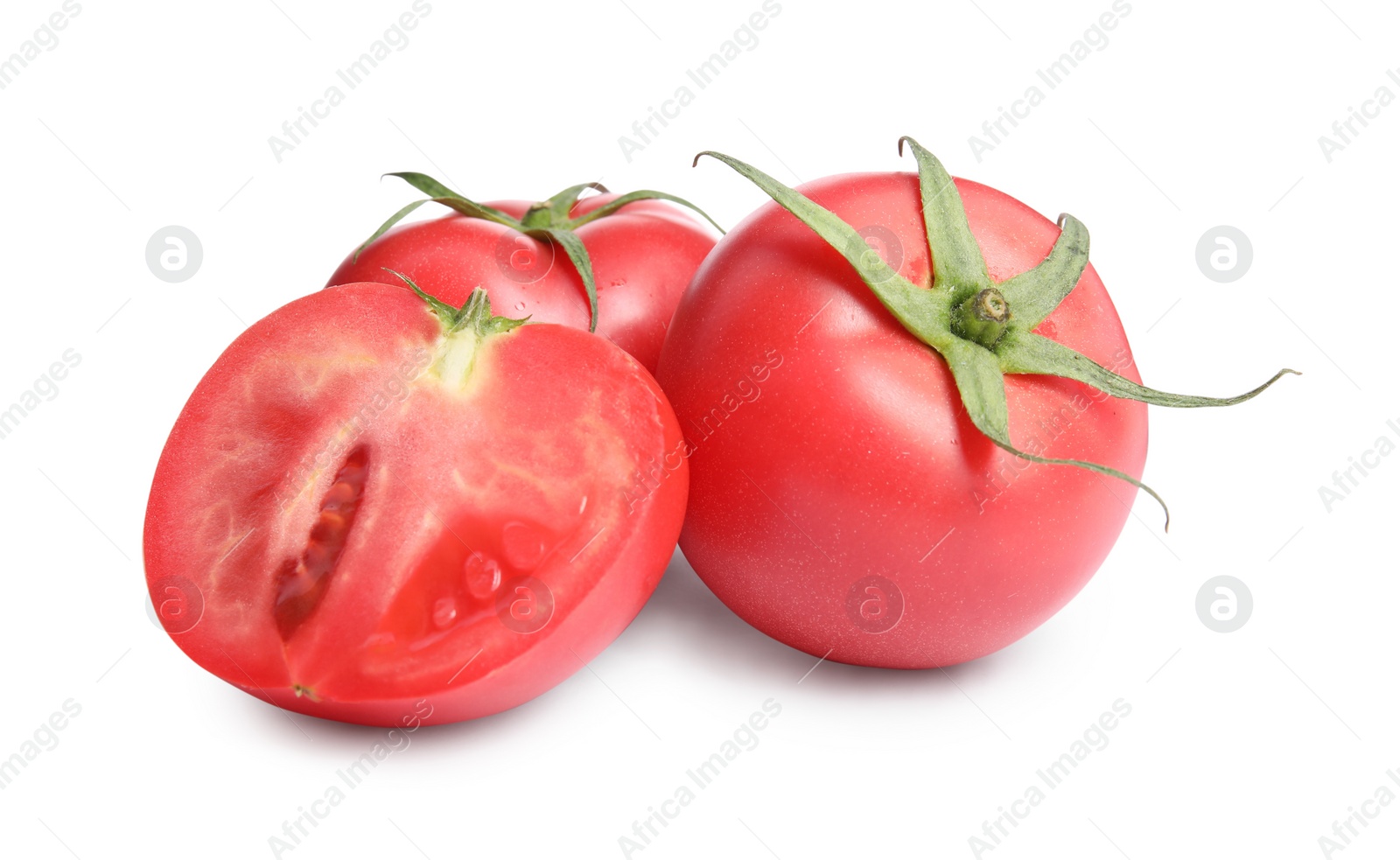 Photo of Whole and cut red tomatoes on white background