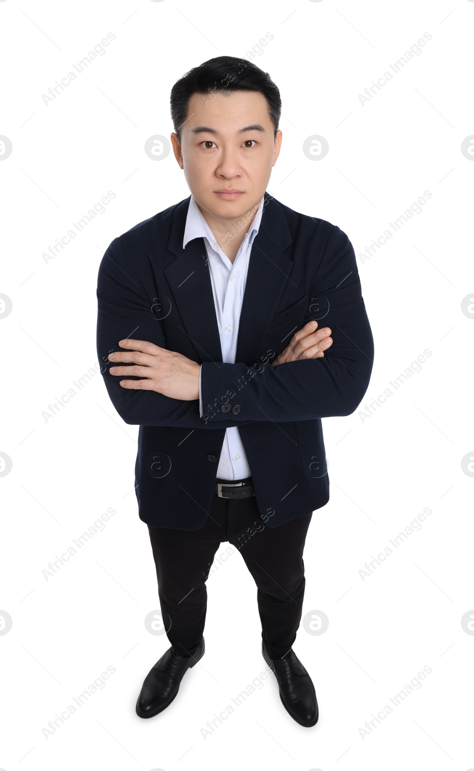 Photo of Businessman in suit posing on white background, above view