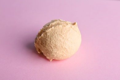 Photo of Tasty vanilla ice cream on color background