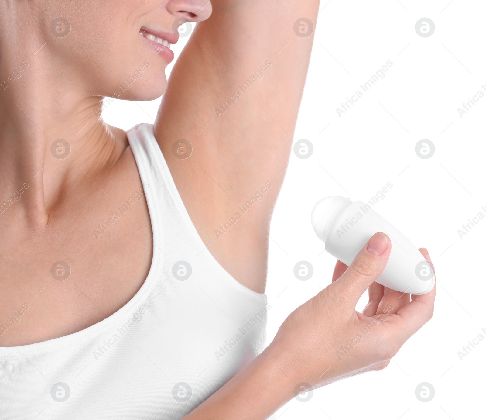 Photo of Young woman using deodorant on white background, closeup