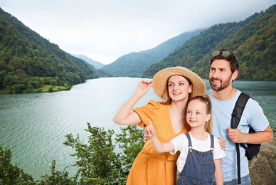 Image of Portrait of happy family with child near palm in mountains