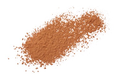 Dry aromatic cinnamon powder isolated on white, top view