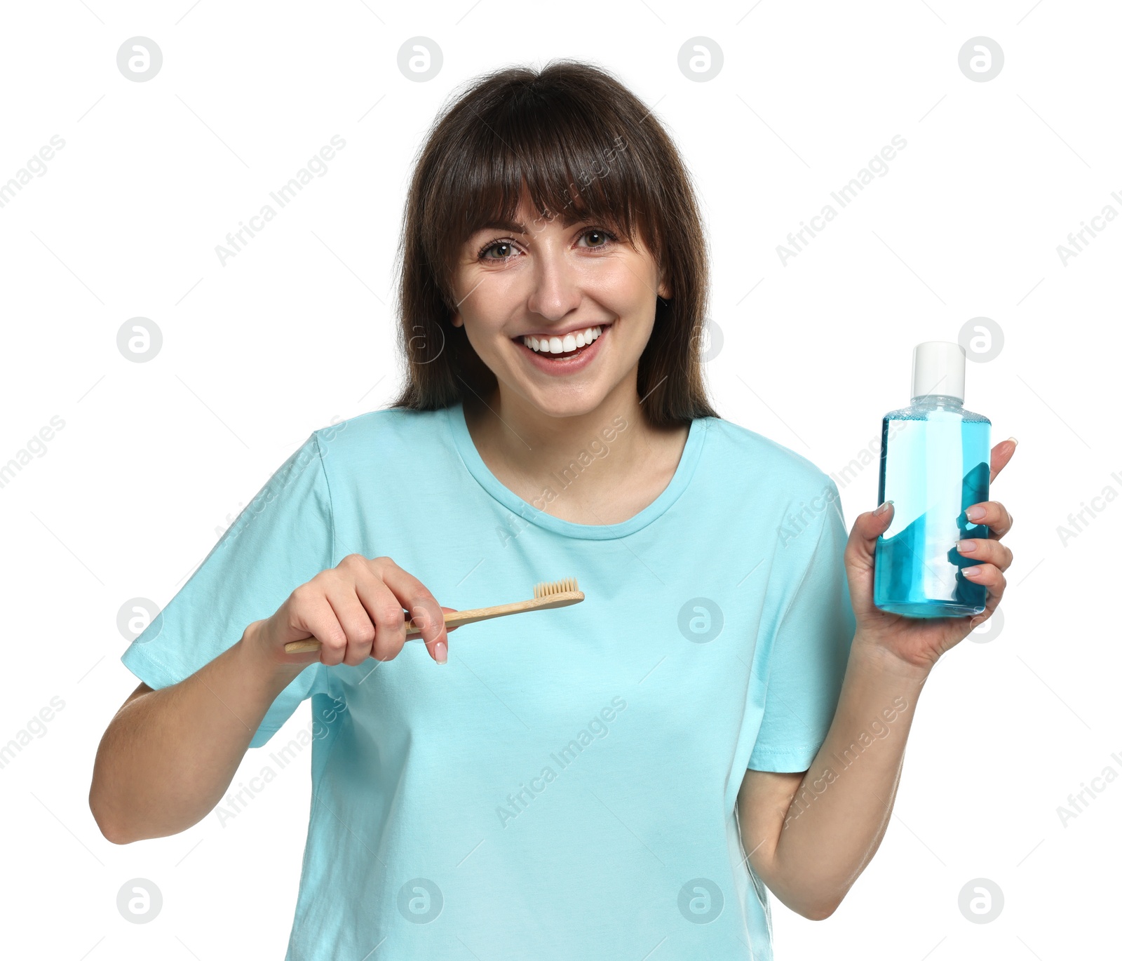 Photo of Young woman with mouthwash and toothbrush on white background