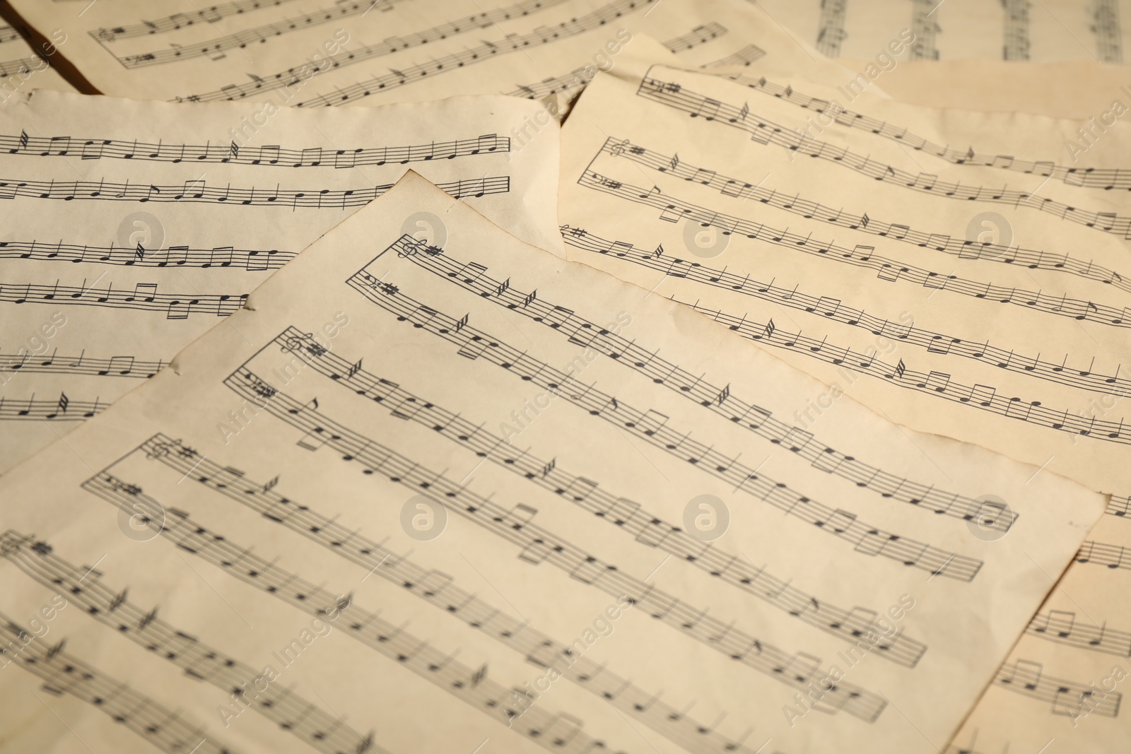 Photo of Many old note sheets as background, closeup