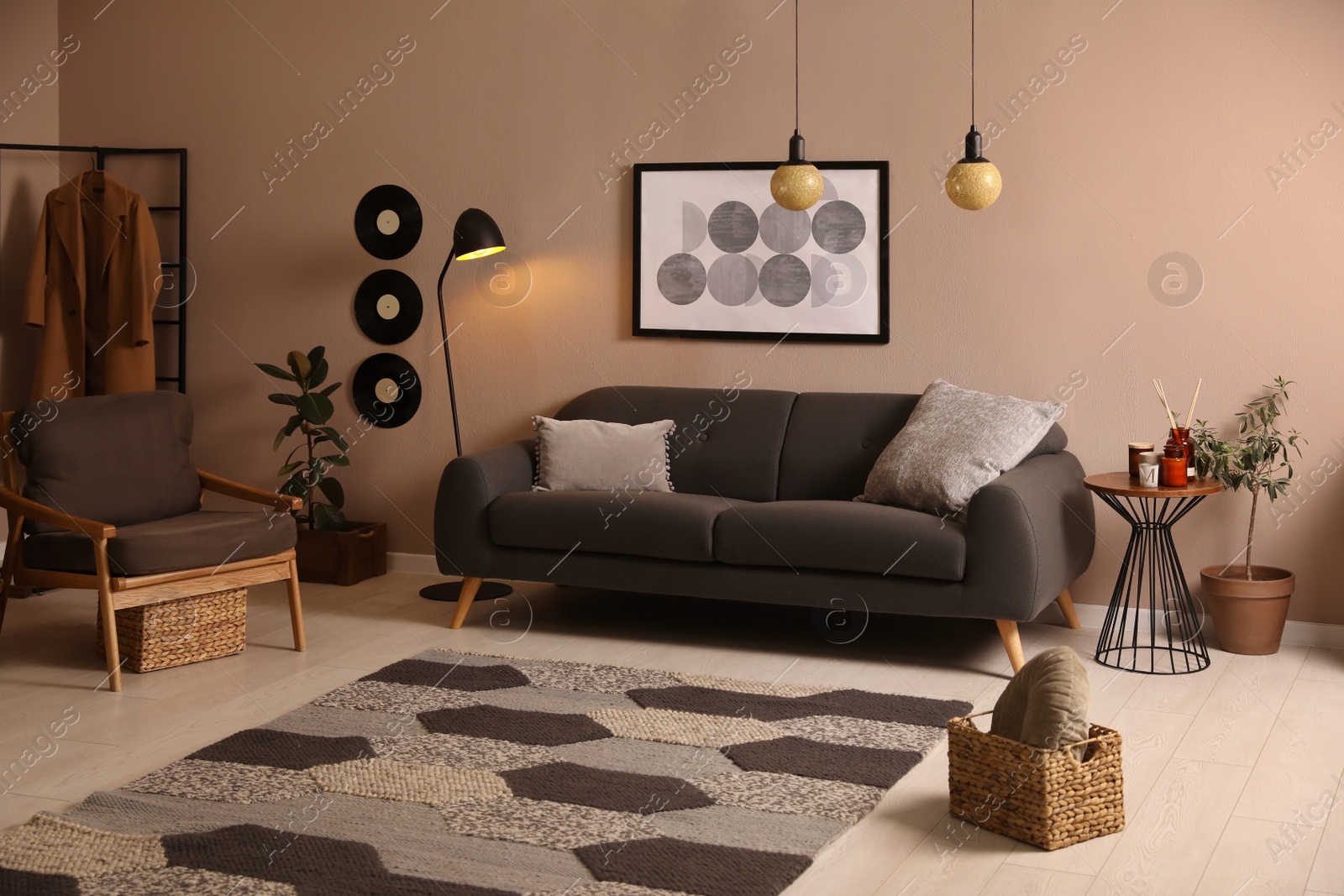 Photo of Stylish living room interior with comfortable dark sofa