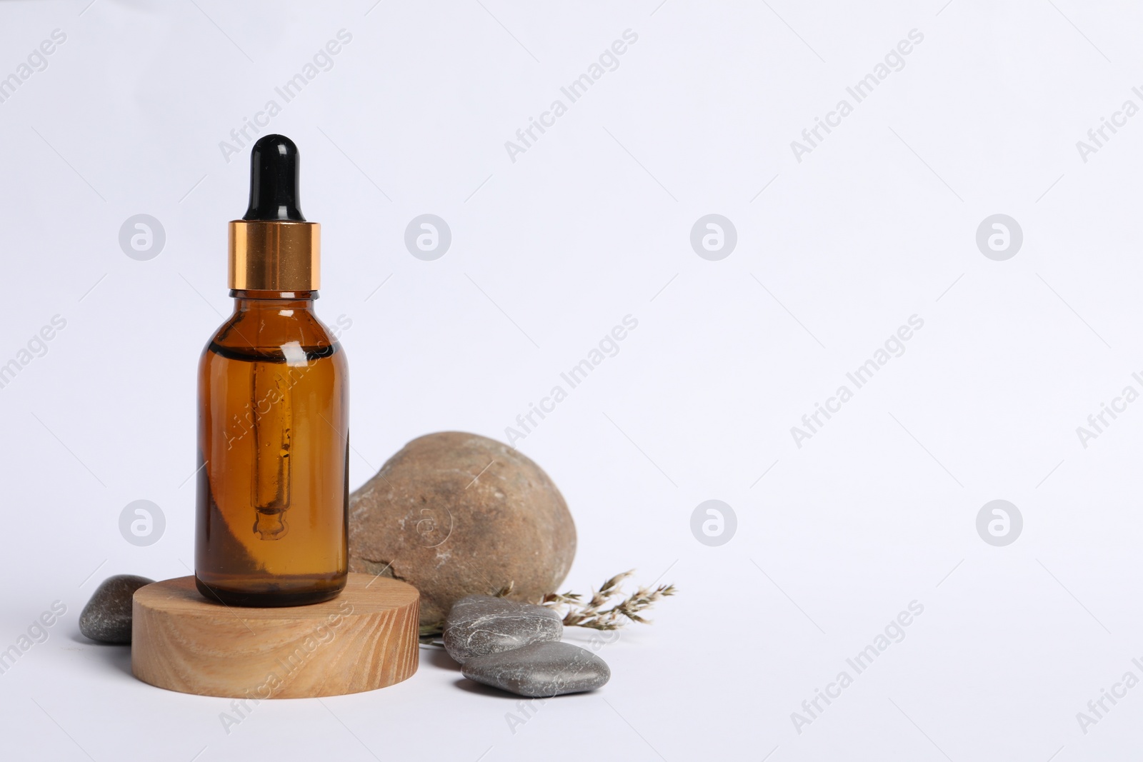 Photo of Composition with bottle of cosmetic serum on white background. Space for text