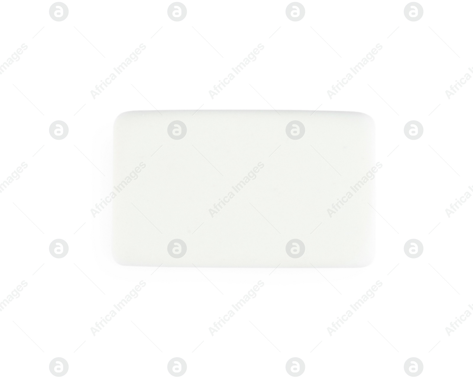 Photo of New eraser isolated on white, top view. School stationery