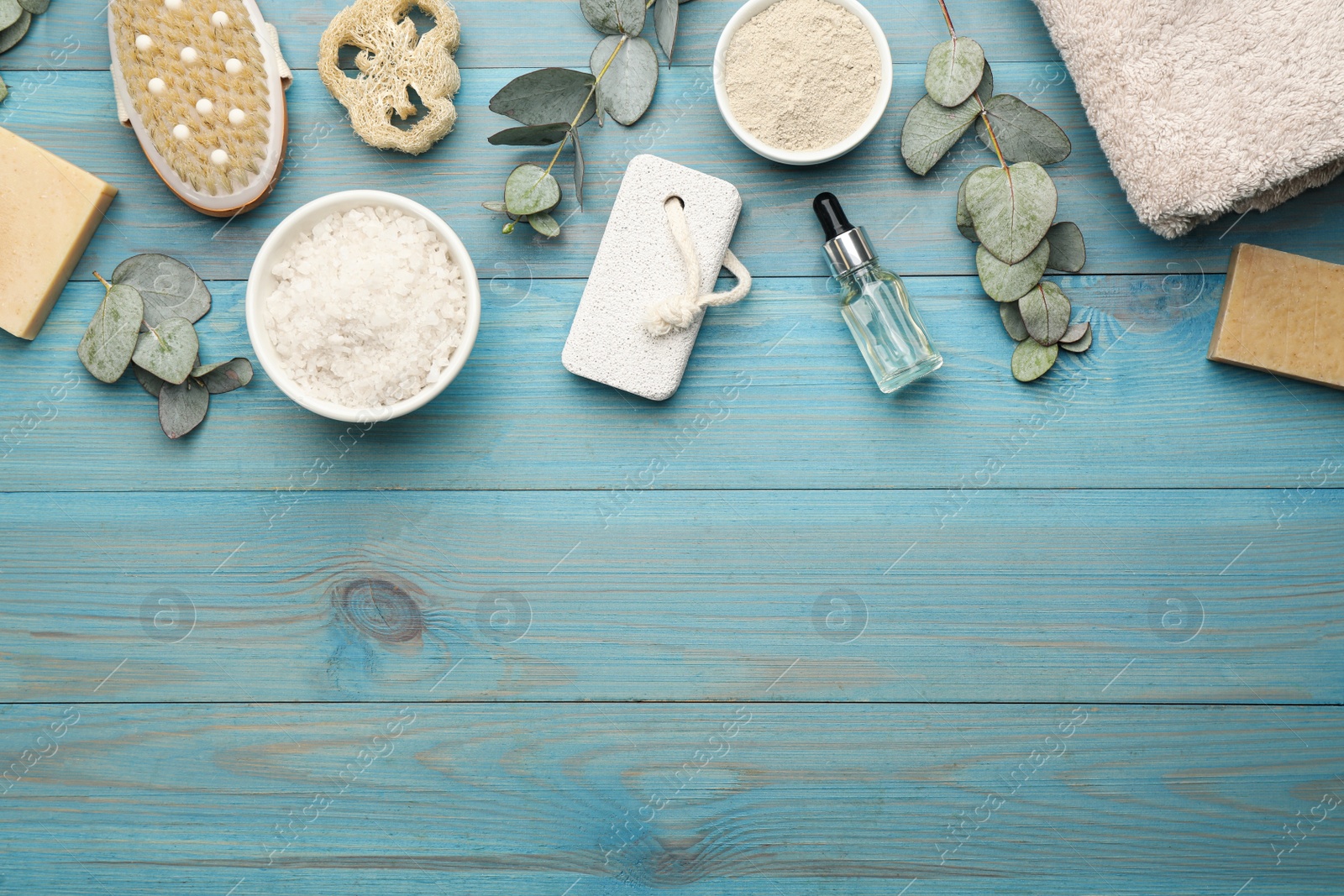 Photo of Flat lay composition with pumice stone on turquoise wooden background. Space for text