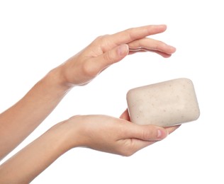 Young woman with soap bar on white background, closeup