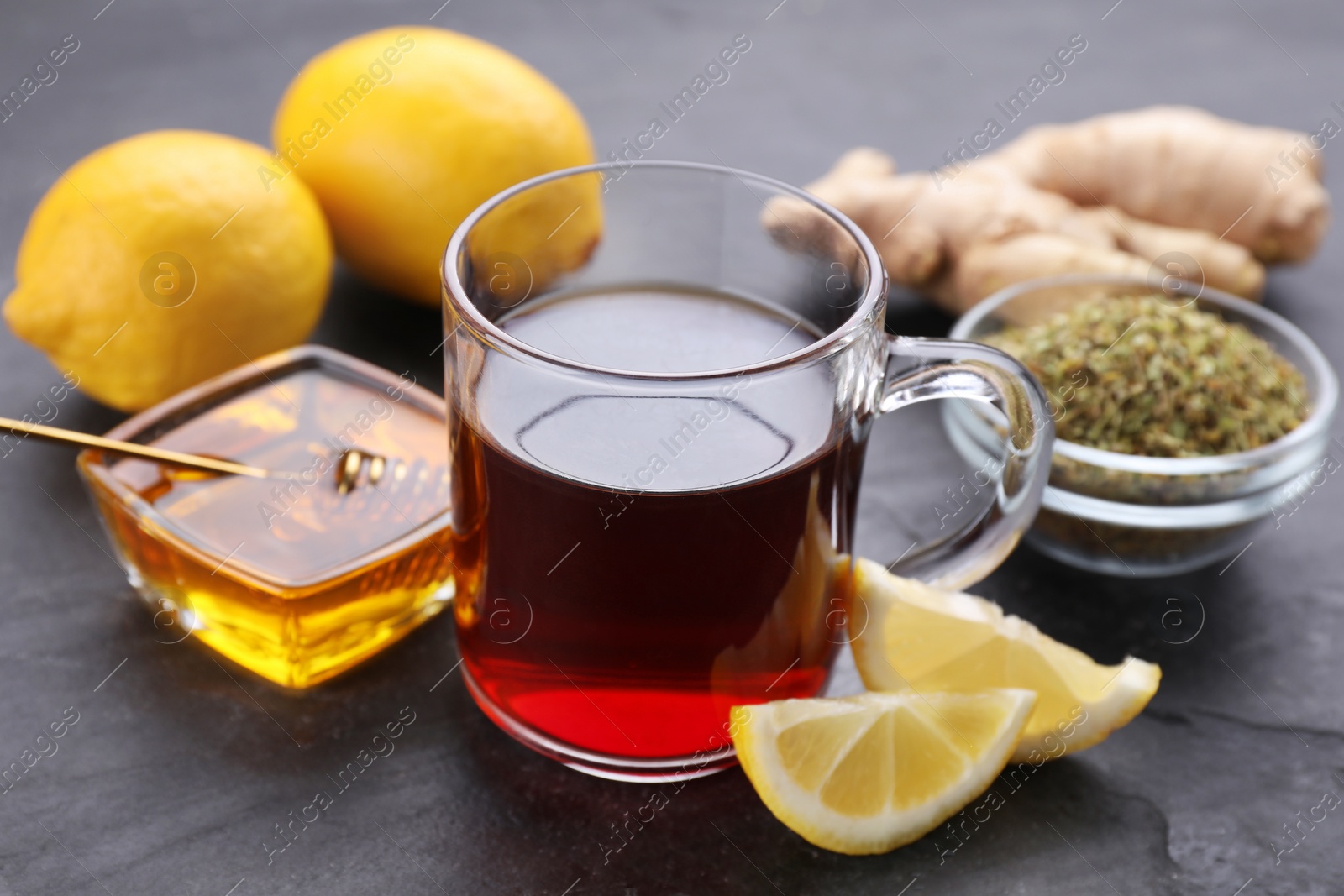 Photo of Cold remedies on black table, closeup. Cough treatment