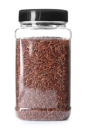 Jar with uncooked red rice on white background