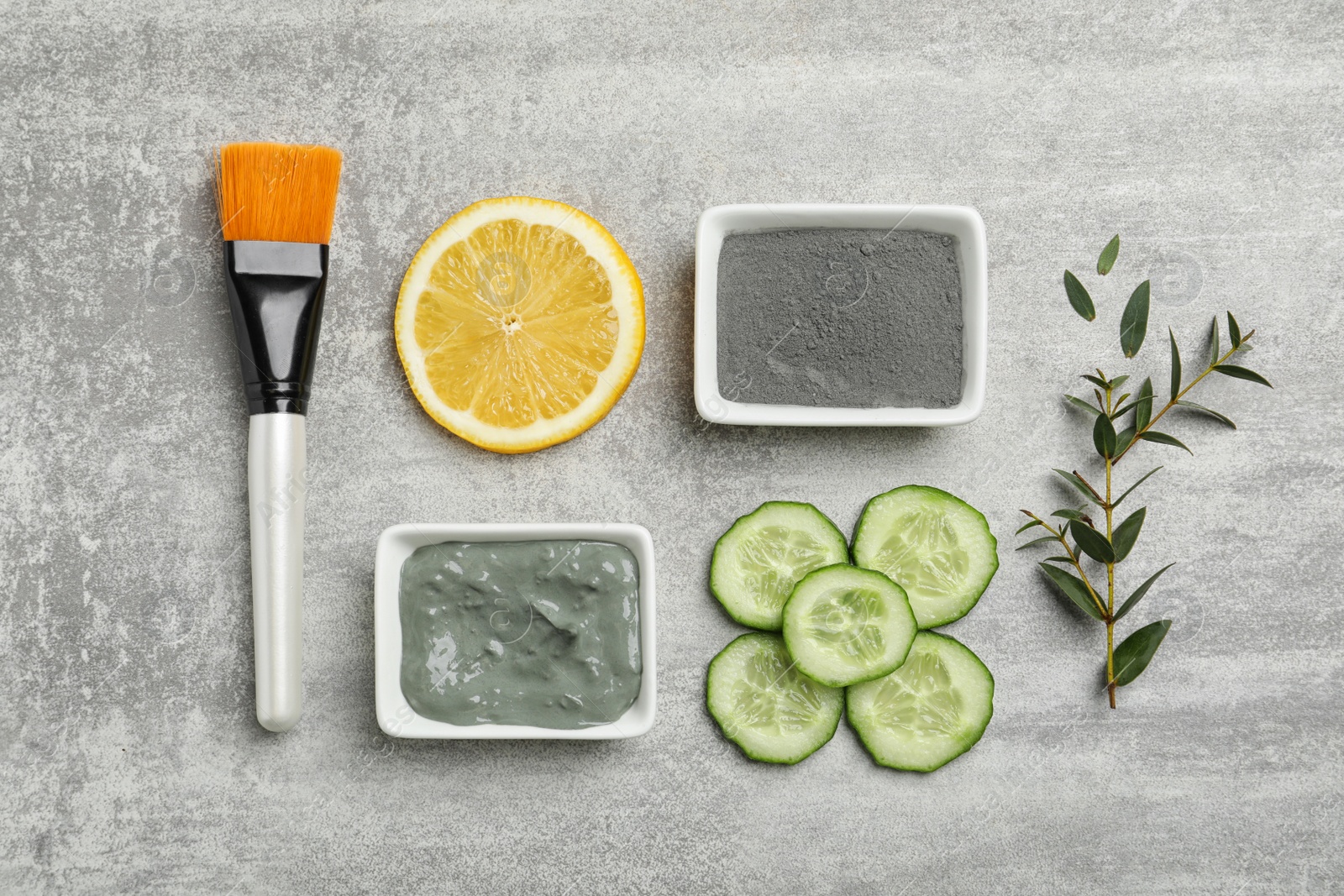 Photo of Homemade effective acne remedies and ingredients on grey background, flat lay