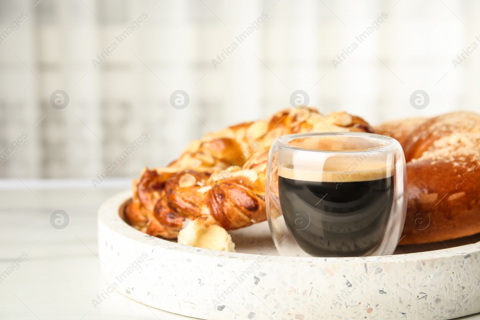 Photo of Fresh tasty pastries and coffee on tray, closeup