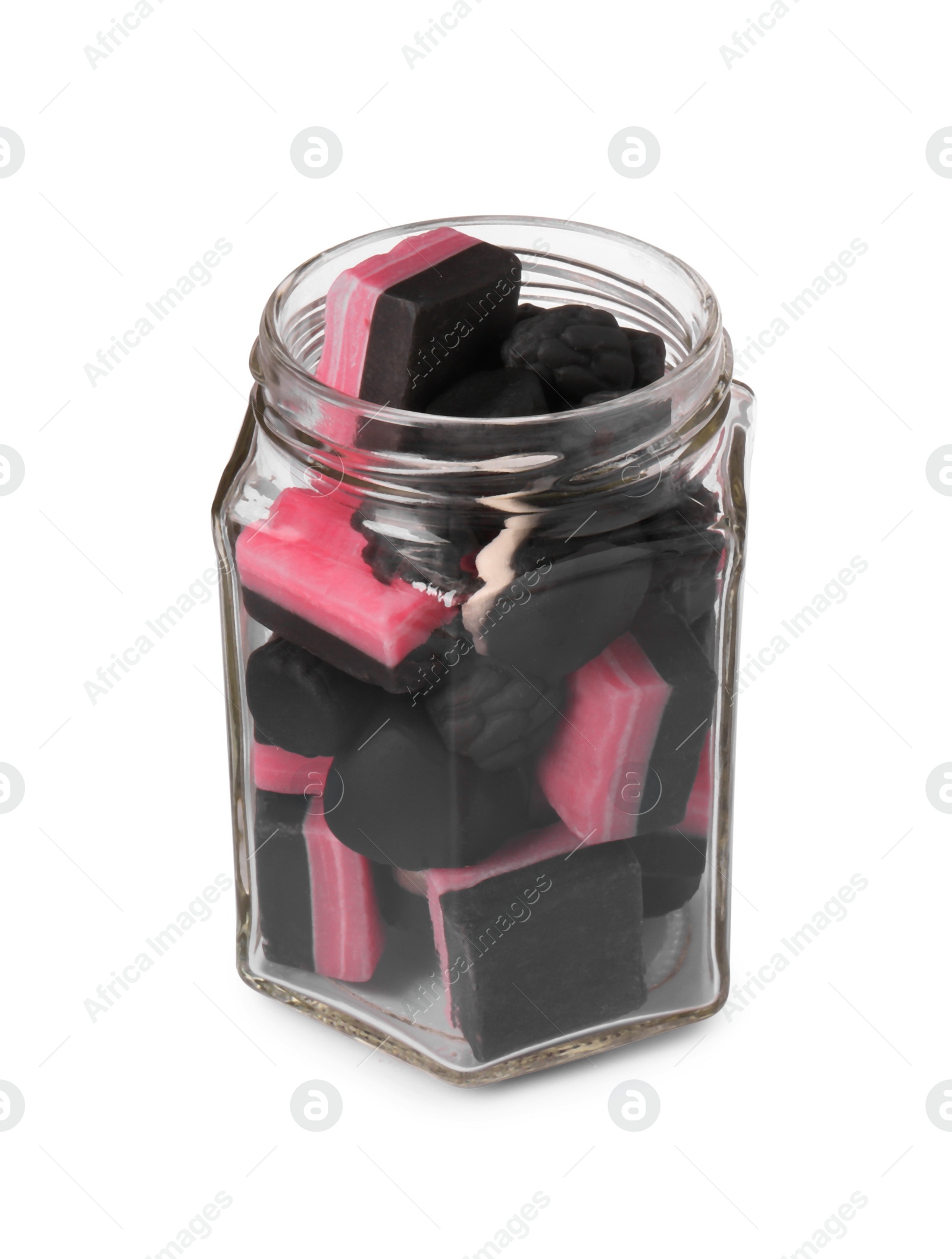 Photo of Glass jar of tasty liquorice candies isolated on white