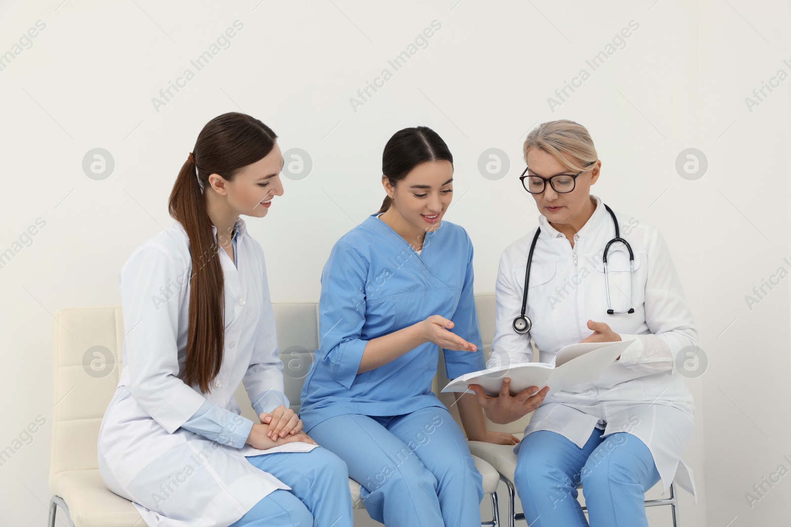 Photo of Team of professional doctors working in office