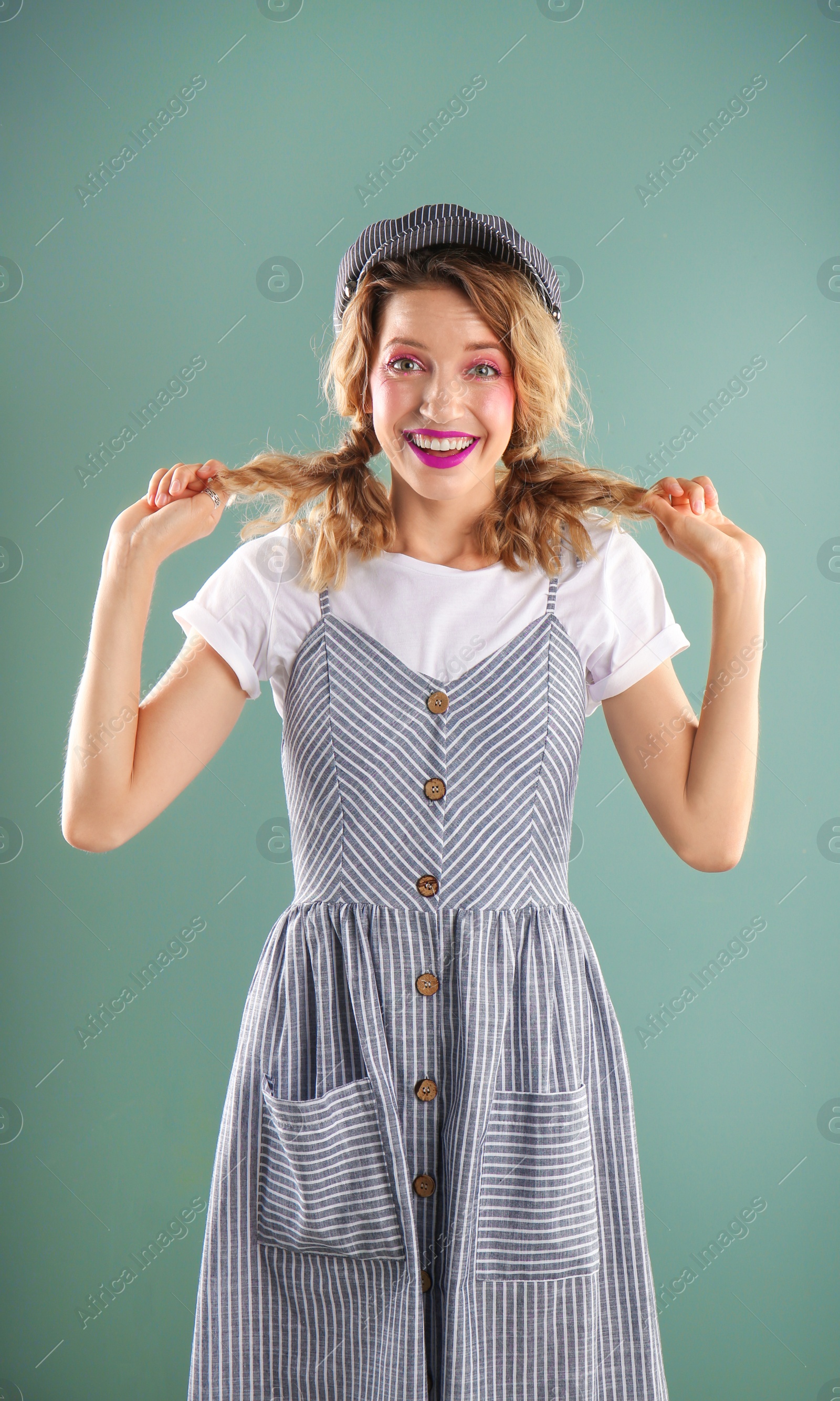 Photo of Beautiful young woman posing on color background. Summer fashion