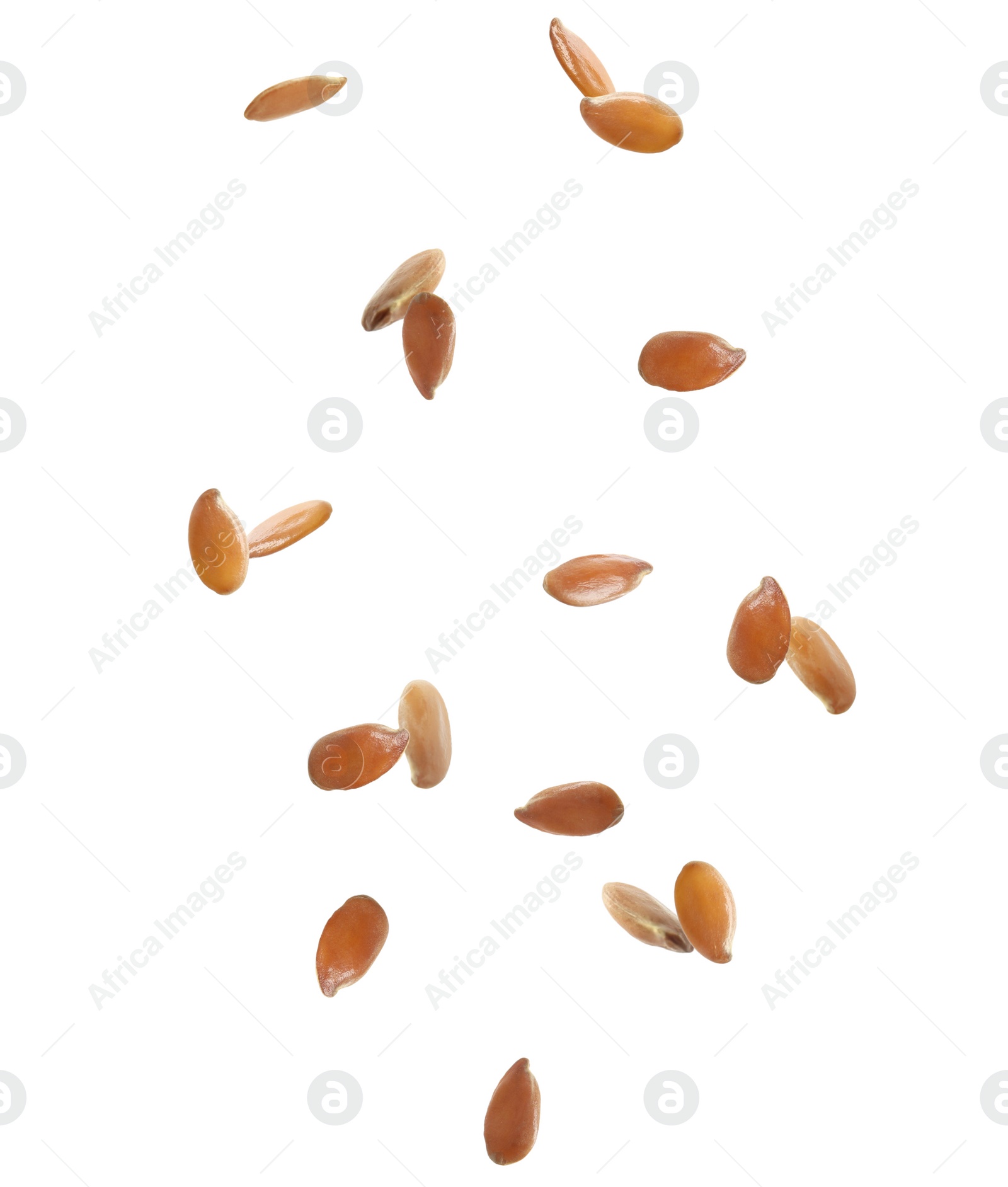 Image of Many linseeds falling on white background. Vegan diet  