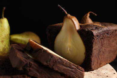 Photo of Tasty pear bread on table, closeup. Homemade cake